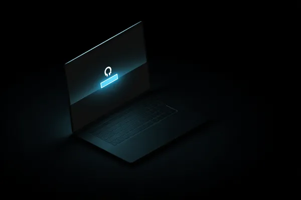 A laptop glowing with a bright login prompt in a minimalistic setup, symbolizing the protected access system at K55GAME.